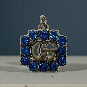 Gucci interlocking G charm with blue rhinestones, zipper pull
